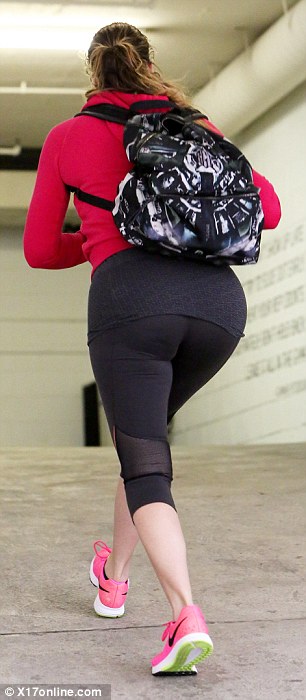 Khloe Kardashian shows off trim figure in leggings