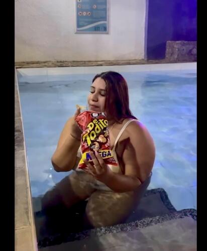 in the pool burping with soda and beer and eating like a pig 😍