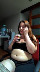 Hot Chubby Woman Filling Her Round Belly with some Ice Cream